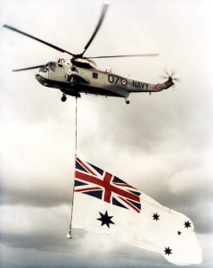 A Sea King flies the White Ensign.