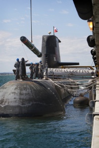 A Submarine Launched Countermeasure Emulator (SLACE) vehicle is embarked onto HMAS Collins from Diamantina Pier at HMAS Stirling.