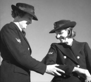 WR/1 Telegraphist Frances Betty Provan (right) and WR/21 Telegraphist Heather Stella Dunshea are proud of their badges, identical to those worn by male naval telegraphists, circa 1941. Australian War Memorial Collection.