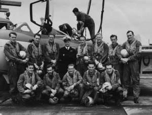 808 Squadron in 1955 posing before a Sea Venom onboard Melbourne. Back row, left to right: LEUTs Peter Wyatt and David Hilliard, LCDRs Peter Seed and George Jude, LEUTs Barry Thompson, Alan Cordell, Edward Wilson and Geoffrey Gratwick. Front row, left to right: LEUTs Ronald McIver, Stanley Carmichael, Keith Potts, Neil Ralph and Bernard Brennan. Thompson and Potts were both killed when their Sea Venom crashed into the sea in 1956. Stanley Carmichael also lost his life in similar circumstances in 1959.