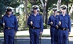 Officers with swords.