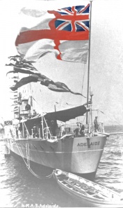 HMAS Adelaide (I) flying the Royal Navy's White Ensign from her quarterdeck.