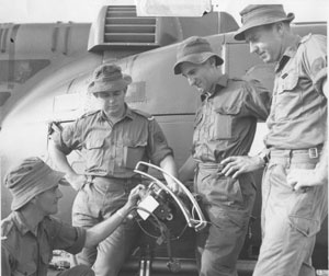 Aircraft maintainers inspecting one of the 135th helicopters. Left to Right: Leading Airman Kevin French, Leading Airman Ray Howell, Naval Airman Ross Herbert an Leading Airman Dave Varley.