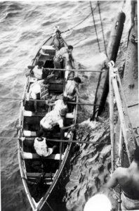 Quiberon's seaboat crew recovering a practice torpedo, circa 1943.