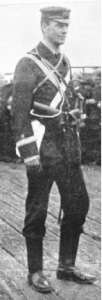 Paymaster Alfred Martin Treacy in marching kit as a member of the  Victorian Naval Brigade deployed to China in 1900 – 1901 Note the two gold stripes of the Paymaster rank (Equivalent to a Lieutenant) with the white cloth of the Accountant Branch in between