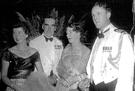 Mrs. Jean Newey with the Flag Officer Commanding the Australian Fleet, Rear Admiral H.M. Burrell, Mrs. Burrell and Acting Commander Ben Newey at HMAS Sydney Ship’s Ball, at the Trocadero 28th September 1955.