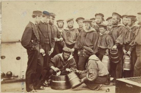 Thomas Bungalene and other crewmembers of HMVS Victoria receiving their rum ration.