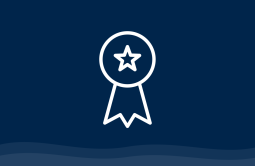 An icon of an award on a navy background.