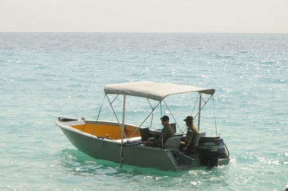 The Royal Australian Navy's Deployable Giospatial Support Team (DGST) conducting survey evolutions at Kakabona Beach in the Solomon Islands in support of Operation ANODE.