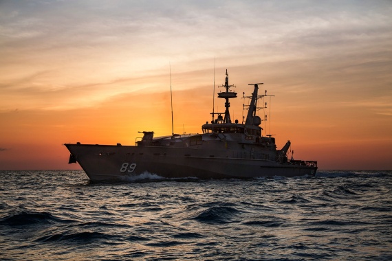 HMAS Ararat sails at sunset off the coast of Darwin, Northern Territory.