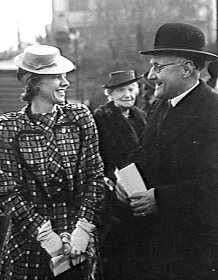 The Minister for the Navy, the Hon NJO Makin MP with the launching lady, Mrs Spender, wife of a member of the Australian Advisory War Council, at the launching of Cowra at Poole & Steel's Dockyard, Balmain, NSW on 27 May 1943. (AWM 305506)