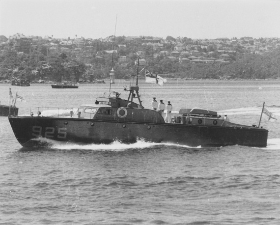 HMAS Air Mercy underway and dressed with masthead ensign in Sydney Harbour, 1953.