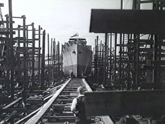 Stawell slides down the ways and into the water at Williamstown, Victoria on 3 April 1943. (AWM 138493)