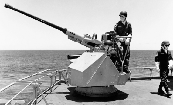 Sailors man one of Success' three 40/60mm Bofor guns during Excercise RIMPAC 1994. These were later removed from the ship.