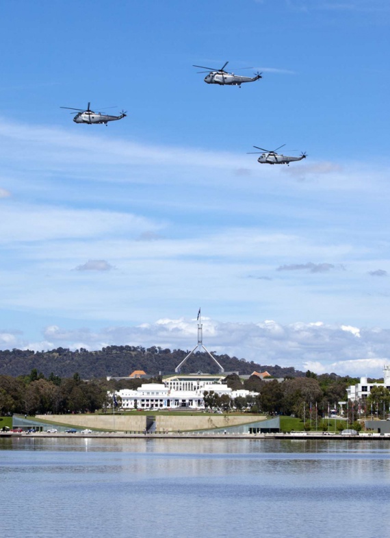 Three Sea Kings fly over Lake Burley-Griffin in Canberra for the last time, 15 December 2011