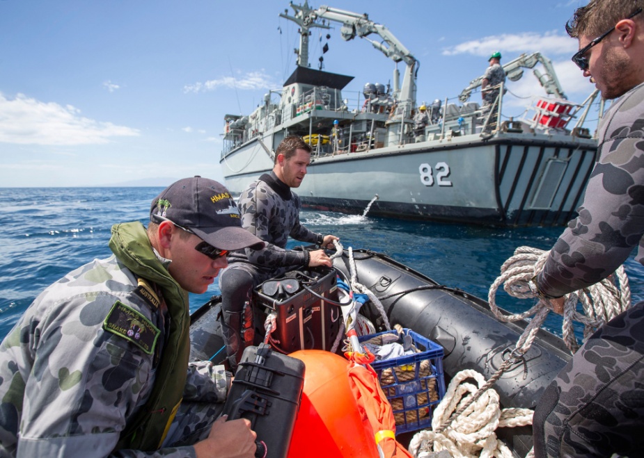 HMAS Huon's Clearance Diving team return to their ship following a successful dive during the Mine Counter Measures and Diving Exercise 2014 in New Zealand.