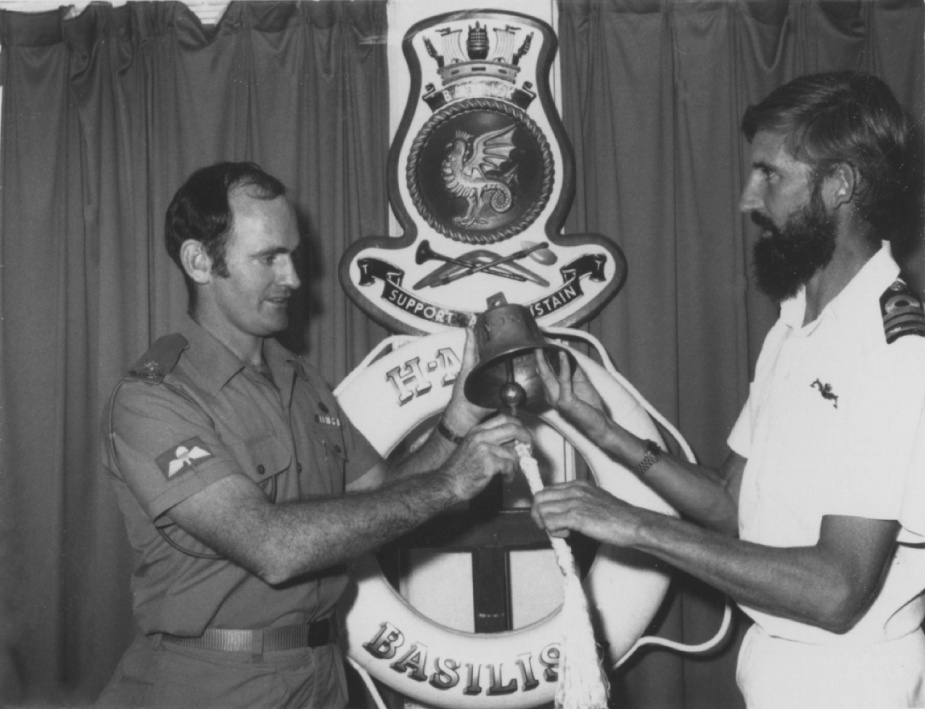 Basilisk Commanding Officer, Commander Peter Pafford, RAN, pictured with ship's bell.