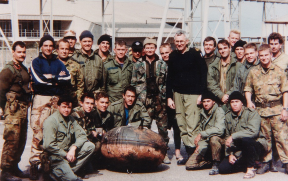 Commodore Christopher Oxenbould, RAN assumed command of the RAN Task Group (CTG 627.4) on 5 December 1990. He can be seen here with members of Clearance Dive Team Three in Kuwait.