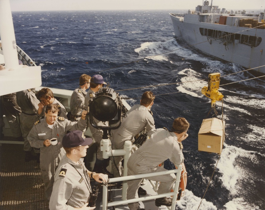 Canberra's command team observe proceedings from the starboard bridge wing as the ship conducts a replenishment at sea with USNS Joshua Humphreys. Middle East Area of Operations 1992.