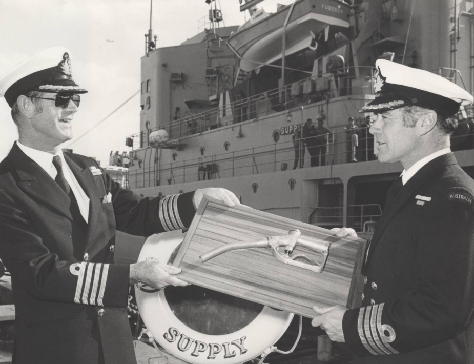 Captain JB Snow hands over the 'bowser' to Captain DJ Martin on rescinding command of Supply on 7 August 1978.