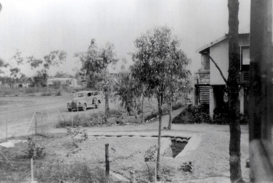 HMAS Melville in early 1942 with slit trenches visible in the foreground. During the many air raids on Darwin it was in these that naval personnel were forced to take cover.