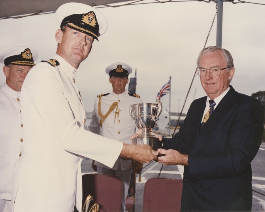 The Governor-General Bill Hayden, AC presented the Duke of Gloucester Cup to the Commanding Officer HMAS Darwin, Commander Martyn Bell, CSC, RAN in February 1992.