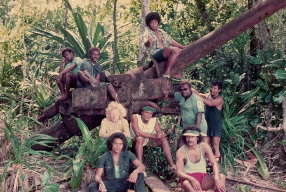 Senior Survey Year Honiara Technical Institute, Enoghae Harbour Survey, 1981 (old Japanese 4-inch gun). L-R, front: Robin Daoe (Nauru), Atalea Kautoke (Tonga). Middle: Fana Patoro (Tuvalu), Fuata Mosese (Fiji), John Suga (master WAKIO), Robin Daoe (Nauru). Rear: Frank and Clifford (SIHU), Telua Sulaki (Tonga).