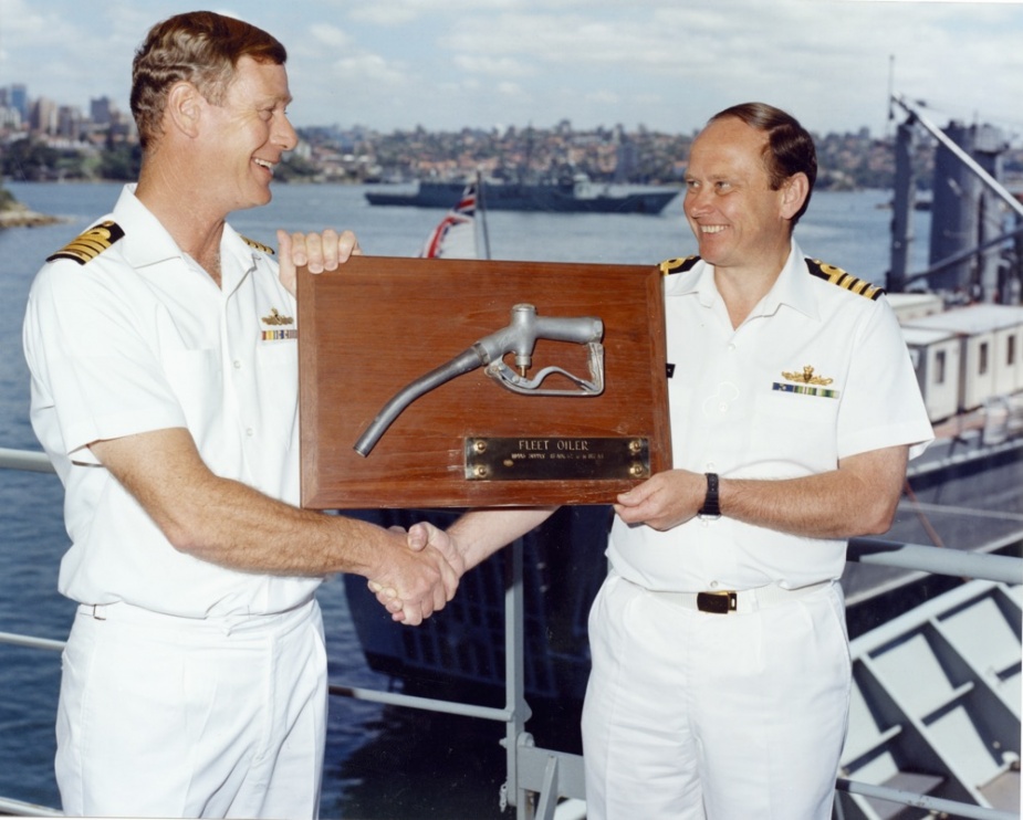 CAPT JS O'Hara hands over the Fleet Oiler shield to HMAS Success’ Commanding Officer CAPT JS Moore.
