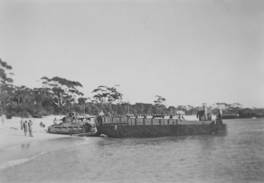 A Matilda tank rolls off a landing craft at Shoal Bay.