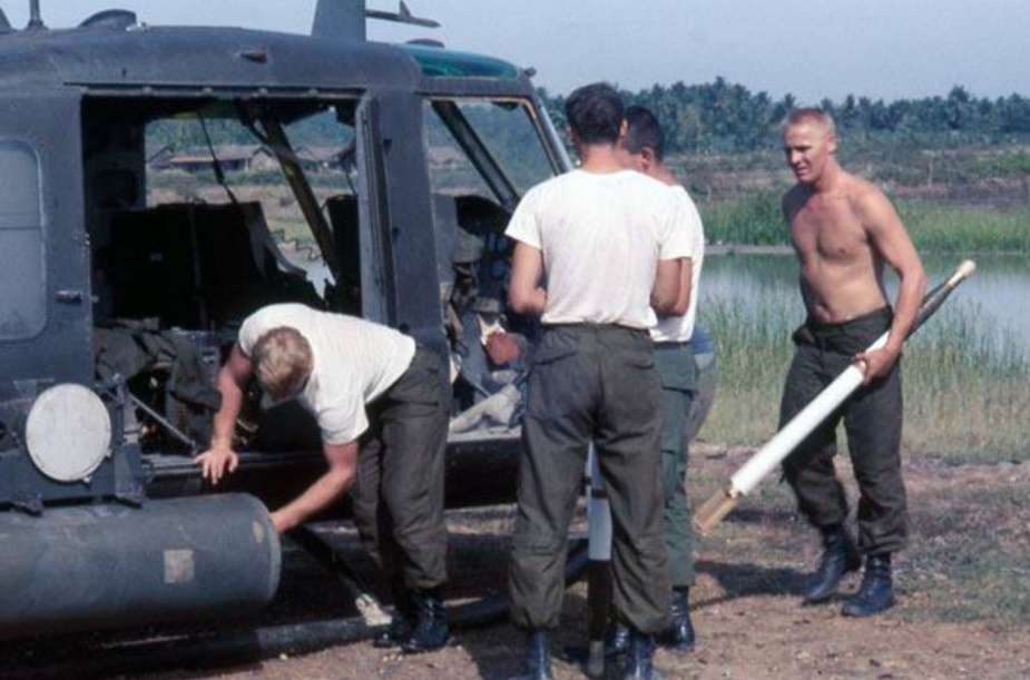 Noel Shipp (at right) rearming the gunship with other members of the aircraft's crew all of whom perished when the aircraft was shot down on 31 August 1968.