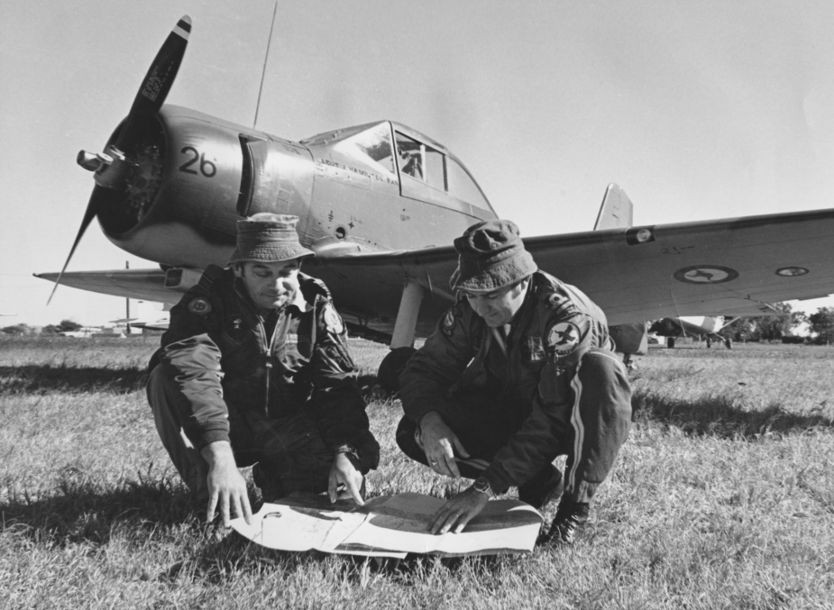 Left: Squadron Leader KJ Mitchell and Lieutenant John Hamilton discuss a Forward Air Control mission during Exercise KANGAROO 1, June 1974.