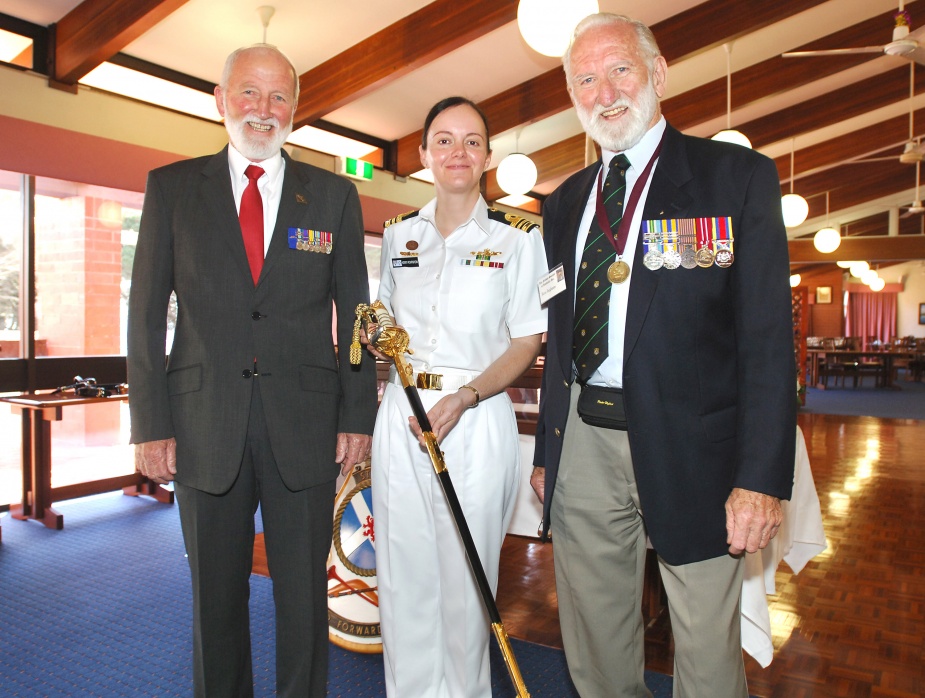 The Admiral Nelson Sword of Excellence recipient for 2009, Lieutenant Commander Kerry Rohrsheim, stands with members of the Nelson Society of Australia, Mr Alan Ingham, left, and Mr Ron Ingham right.