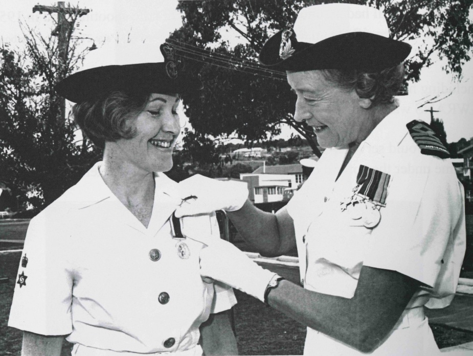 Superintendent Joan Streeter presents Mercia Kaczmarowski with the Long Service and Good Conduct Medal, circa 1971.