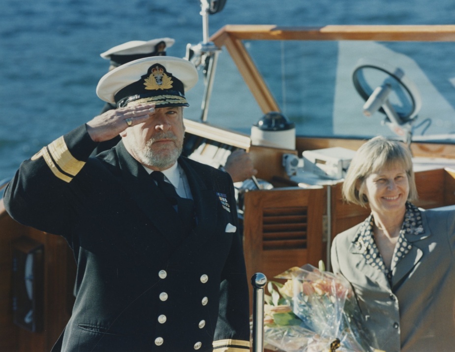 RADM Campbell returns a salute in the presence of his wife at the end of his tenure as the Naval Support Commander in May 1997.