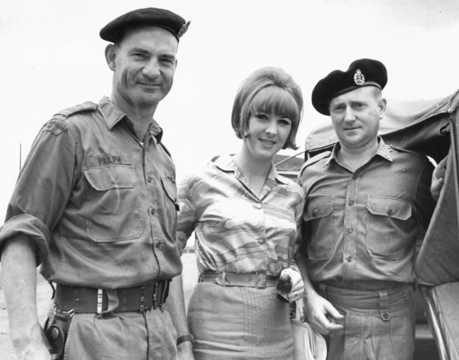 Lieutenant Commander Neil Ralph with Kelly Green and Mechanic Air Electrical 1st Class Ray Homer, May 1968. Kelly was part of group of Australian entertainers providing performances in Vietnam.