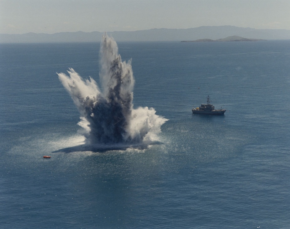 HMAS Shoalwater stands off at a safe distance. 