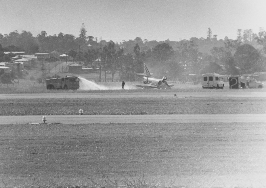 Barry walks away from Skyhawk 887 following his 'wheels up' landing at RAAF Amberley..