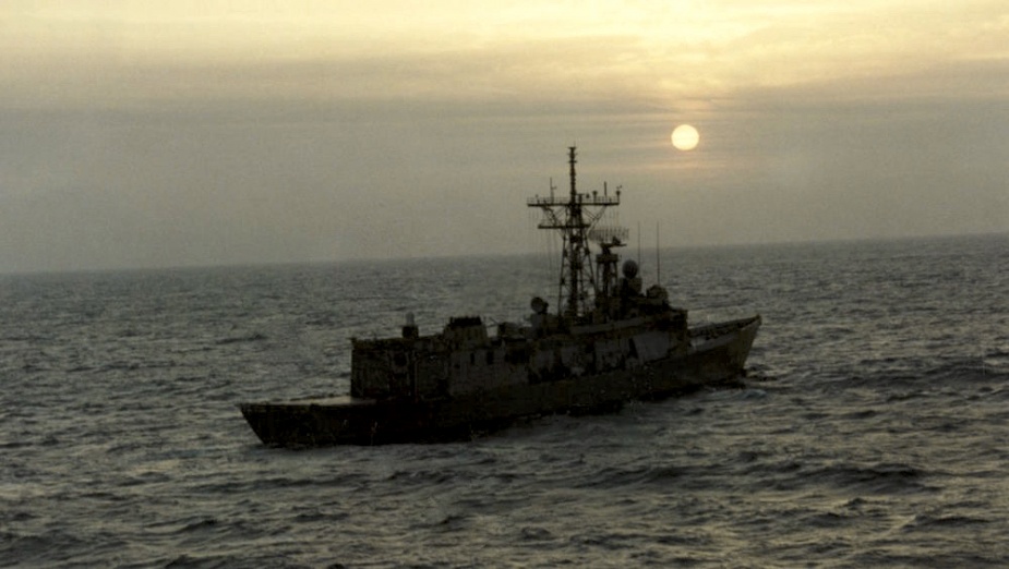 Top: Sydney makes a replenishment approach on a tanker during operations in the MEAO. Note the Radar Absorbent Matting (RAM) affixed to her superstructure for this deployment. Bottom: Sydney on patrol in the MEAO.