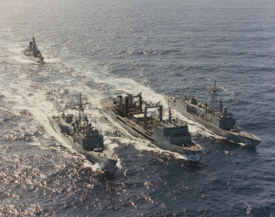 Sydney (far right) departs for RIMPAC 94 in company with HMA Ships Success (centre) and Darwin (left), and, in the background, HMAS Hobart.