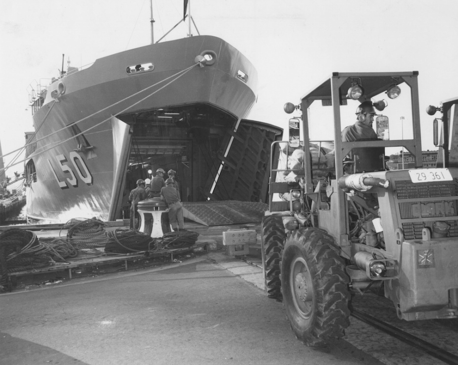 Tobruk taking on supplies through her bow door in Sydney. Her roll on/roll off capability was an invaluable asset to amphibious operations. 