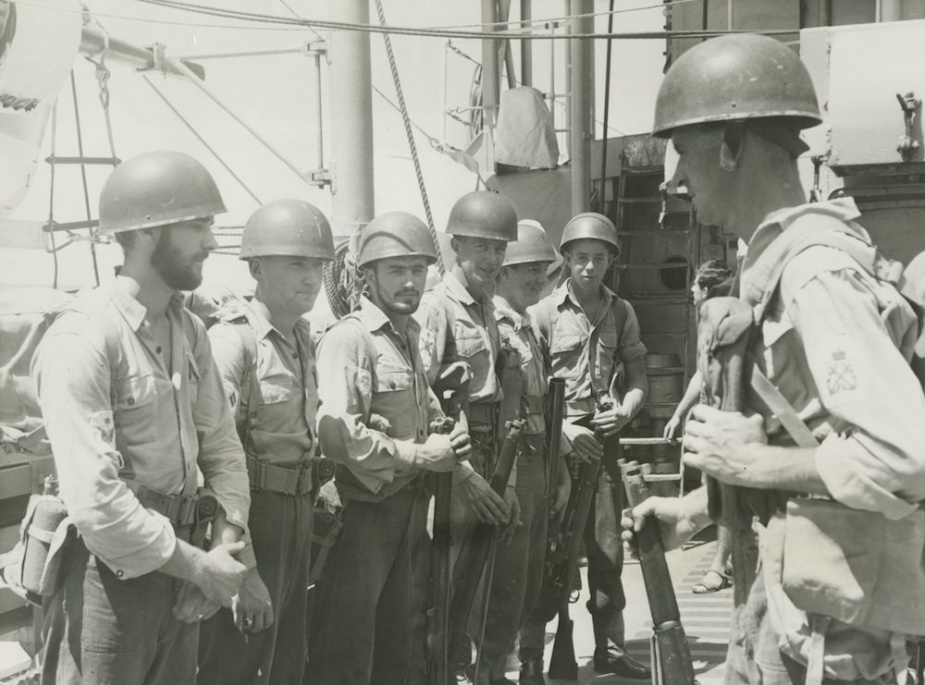 Petty Officer George Sewell briefing a landing party from Voyager during exercises in S E Asia. The party comprises L-R Brian Jackson, Douglas Bain, Reginald Stevenson, Ronald Williams, Edward Marschenko and Walter Priddle.