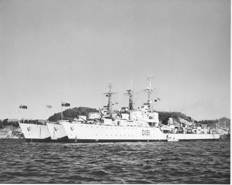 HMA Ships Warramunga and Bataan flank HMS Charity in Yokosuka in January 1951.