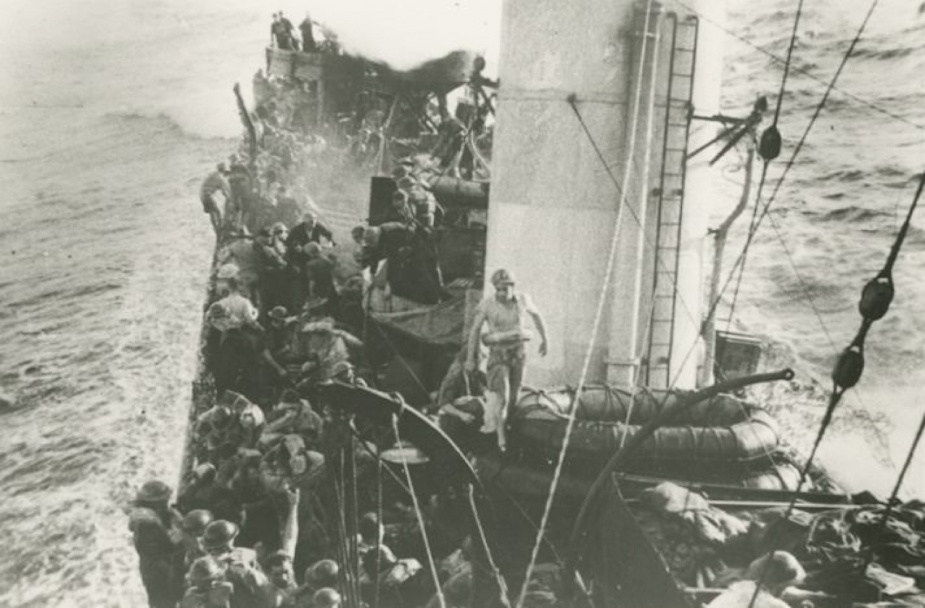 The crew of HMAS Waterhen getting ready to abandon the sinking ship.