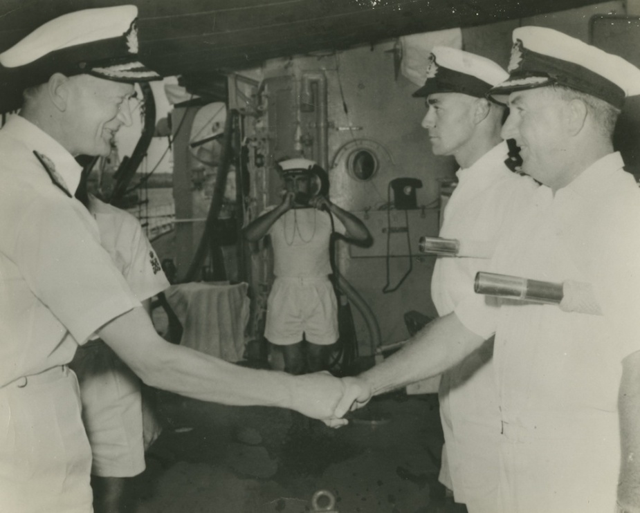 Admiral Sir David Luke (C-in-CFEF) arriving on board HMAS Voyager in 1963. He is pictured meeting Captain D.N. Stevens and Lieutenant D.J. Martin