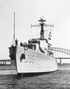 HMAS Anzac departing Sydney Harbour to begin her second tour in Korea, September 1952