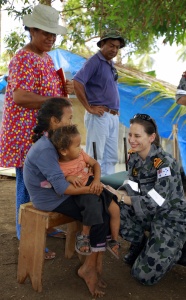 Lieutenant Commander Susan Sharpe, Medical Officer HMAS Tobruk, prepares to see a patient at the temporary medical area on the Tongan island of Niuatoputapu during Operation SAMOA ASSIST.