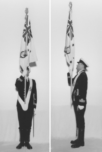 A Colour Officer parading the Queen's Colour dressed in full ceremonial attire.