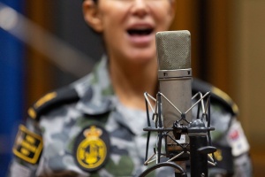 Royal Australian Navy Band member, Able Seaman Musician Leigh Robke singing at Studios 301 in Alexandria, Sydney. Image by ABIS Jarrod Mulvihill.