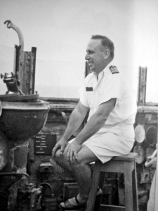 Captain Waller on the open bridge of the light cruiser HMAS Perth (I).