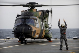 MRH 90 'Cobra 08' prepares to take off during the First of Class Flight Trials onboard HMAS Manoora.